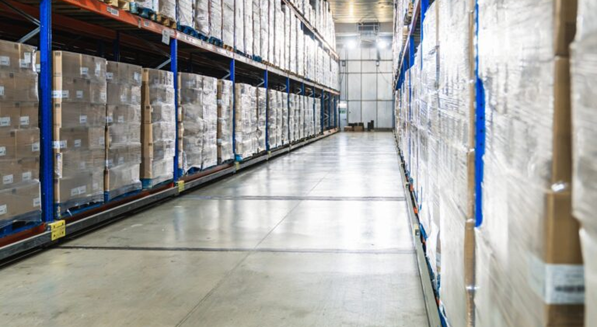 Warehouse aisle with stacked boxes