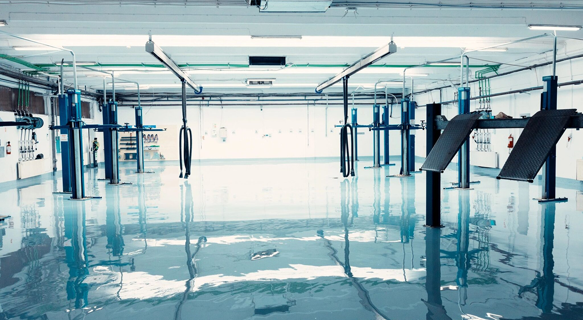 Modern garage interior with hydraulic lifts