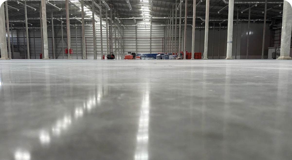 Spacious industrial warehouse with high ceiling.